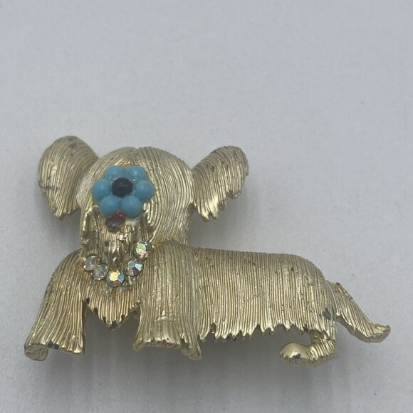 Vintage Marcel Gold Tone Dog Pin Brooch Blue Flower Rhinestone Maltese Shih Tzu - Picture 1 of 5